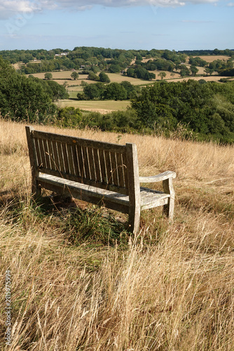 Wooden bench with view looking over High Weald landscape, Burwash, East Sussex, England, United Kingdom, Europe