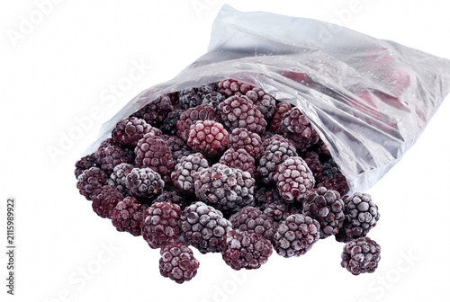 Chilled frosty blackberries spilling from a clear plastic storage bag