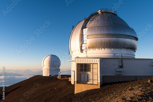 Картината върху платно Astronomy and space exploration, observatory domes on mountain peak at sunset