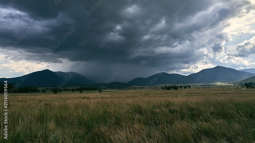 Obraz premium Beautiful and breathtaking view of rain over distant hills. Landscape of rainy hamra over hills.