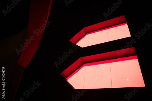 Modern architecture featuring illuminated red windows