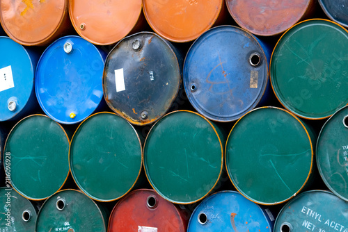 Obraz na płótnie Stacked steel oil and chemical barrels in an industrial warehouse