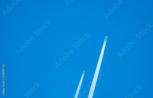 Obraz na plátně Two airplane with white condensation tracks