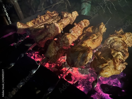 Pork grilled over coals in the evening heat