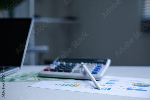 audit auditing auditor calculate management financial calculation.Financial audit and accounting workspace with calculator, reports and business documents for tax planning and compliance.