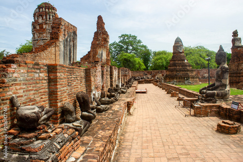 Photography Broken Buddha Statues at Historical Ruins of Wat Mahathat Temple in Ayutthaya Ancient Capital, Thailand