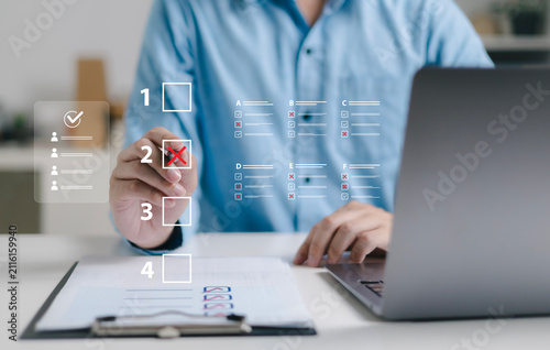 Business professionals use laptops to approve test requests, evaluate online documents, conduct paperless online surveys, and conduct online exams.