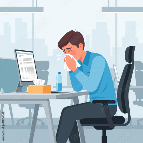 Ill Employee Sneezing In Office Desk And Blowing Nose With Tissue