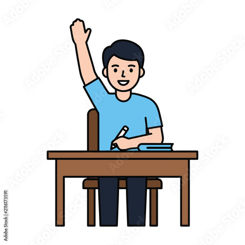Smiling student raising hand in classroom setting with desk and chair