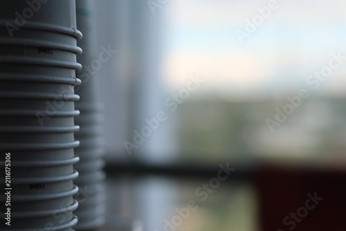 A stack of paper disposable cups.