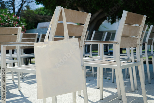 Canvas tote bag mockup on chair outdoors