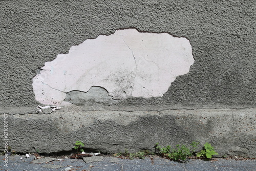 Peeling surface plaster of exterior walls.