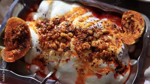 Close-up of traditional Turkish yogurt tantuni with melted butter sauce