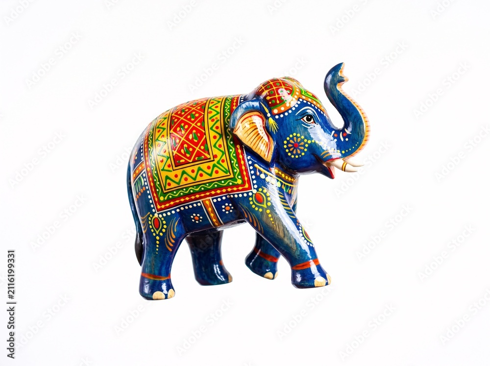 Fototapeta premium Decorative blue elephant figurine with intricate traditional hand painted floral patterns and gold accents standing on a white background representing cultural art and spiritual symbolism