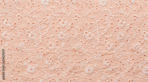 Peach fabric with white floral embroidery pattern
