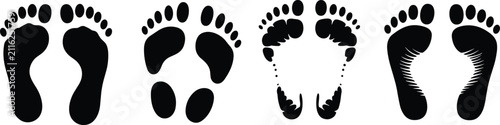 Cuadro en lienzo Set of four distinct human footprint silhouettes in black ink, showing various f