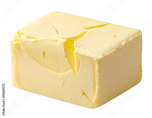 Single block of fresh yellow butter isolated on a solid black background