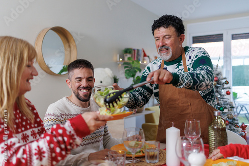 Family enjoying christmas meal sharing healthy salad