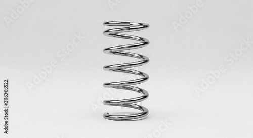 A shiny metal compression spring isolated against a subtle gradient background, representing mechanical engineering and industrial components.