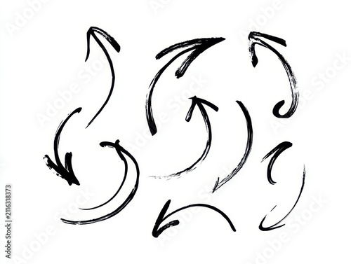 Handdrawn brush stroke arrows set, artistic ink sketches, isolated on white background