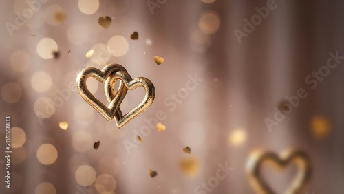 Golden heart shape floating in sparkles
