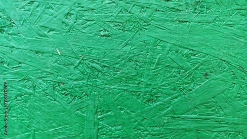 фотографія Vibrant Green Flakeboard Colorful coated composite wooden panel surface for crea