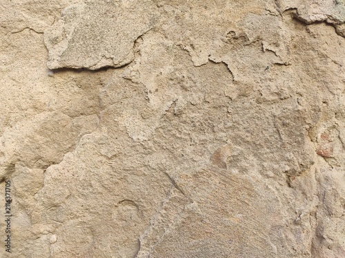 Foto Uneven Adobe Plaster Lumpy light brown architectural coating for traditional Med