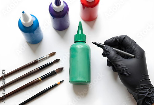 Artist hand in black glove ...
