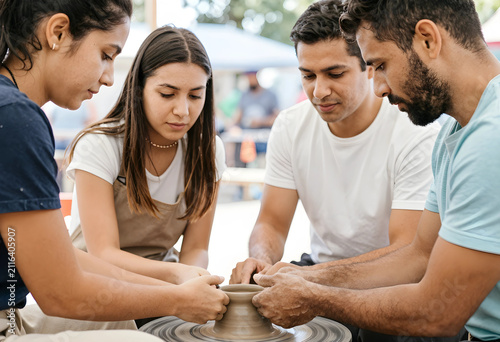Four young adults learning ...
