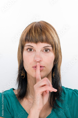 finger at the lips