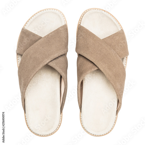 Fotografie Top view of beige suede crossover slide sandals isolated on white background