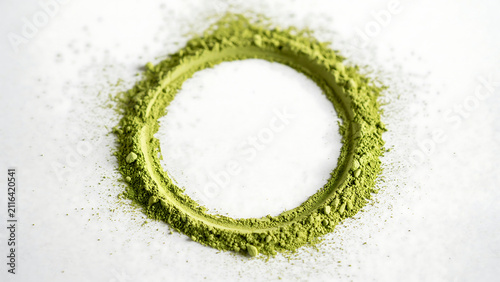 Perfect circle of bright green matcha green tea powder isolated on white background with ingredient isolated culinary antioxidant japanese superfood wellness nutrition preparation