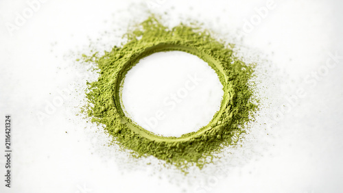 Circle shape made of green matcha tea powder on white background with ingredient culinary antioxidant superfood beverage preparation japanese wellness