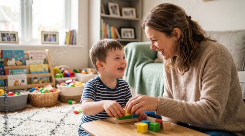 Happy small boy with down syndrome playing with mother at home for warm family moments and joyful interactions