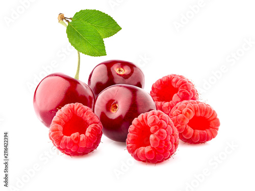 Sweet cherries with raspberries isolated on white background cutout. Ripe berries closeup.  Berries assorted.