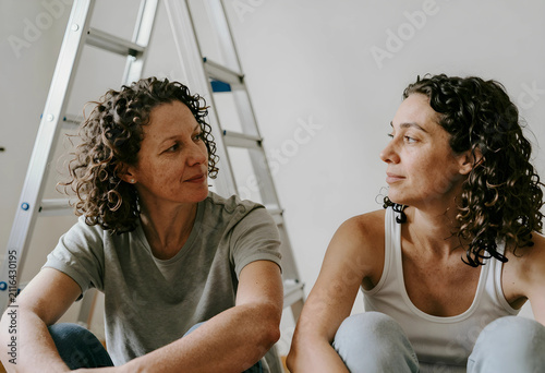 Two women with curly hair s...