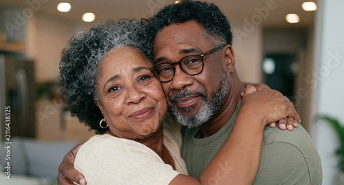 Affectionate Senior Woman and Adult Man Sharing a Warm Embrace at Home