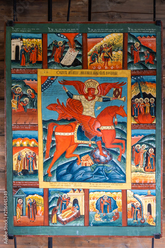 View of the religious icon of Archangel Michael on horseback with surrounding biblical scenes in the Kizhi museum, Petrozavodsk, Republic of Karelia, Russia.