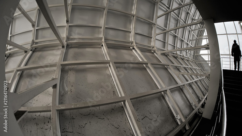 Abstract low angle view of contemporary architectural ceiling with glass panels and metal frame