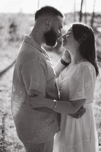 Fotografie Loving couple embracing outdoors, engaging in intimacy and summer romance, celeb