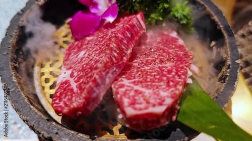 Juicy fresh premium raw meat steak preparing for grill in Japanese style BBQ barbecue at restaurant. fresh Kobe Wagyu beef raw sliced with marbled texture.