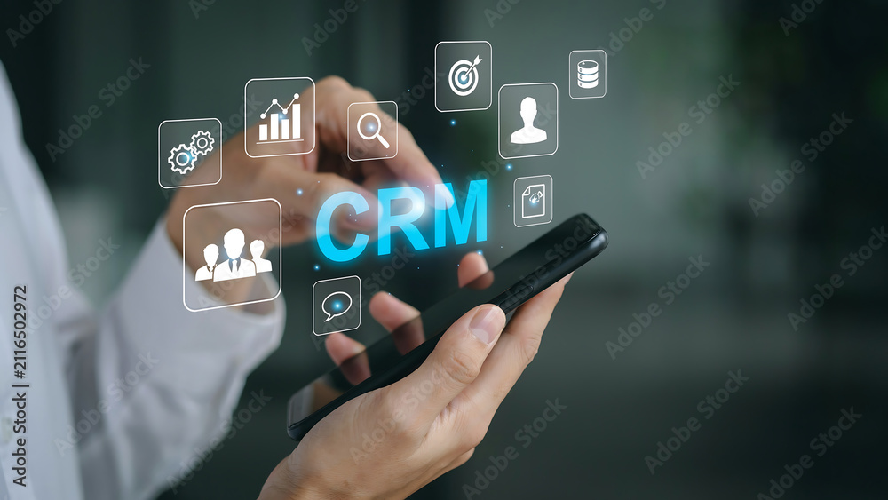 Fototapeta premium Business professional using mobile phone for crm data management with business management customer technology interface marketing software communication analytics strategy connection