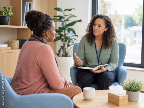 professional social worker counsels client in a confidential daylight office setting