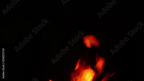 Isolated campfire flames burning on black background with real ambient crackling fire audio soundscape for video editing overlay VFX dark atmospheric background and relaxation screensaver.