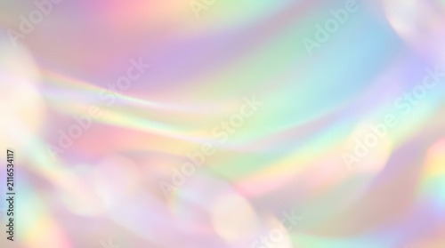 Abstract pastel gradient with soft bokeh shapes and light bands in a studio backdrop.