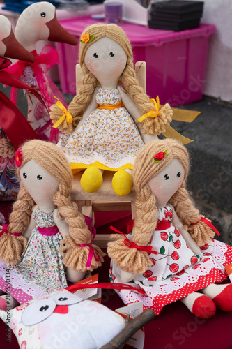 Handmade rag dolls with long hair in folk dresses at market, Canary Islands, Spain