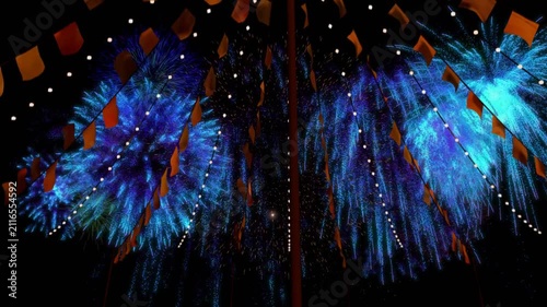 Launchers firing shells, cyan fireworks forming canopy over mast with lit flags for festival