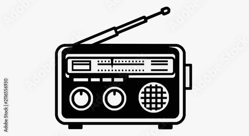Fotografie Portable vintage radio with dial controls.