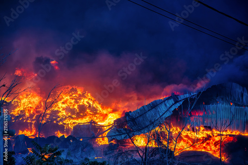 Bild auf Leinwand Large Industrial Structure Burning During the Oraiokastro Wildfire Crisis