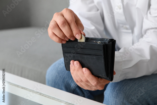 Person putting a coin into ...